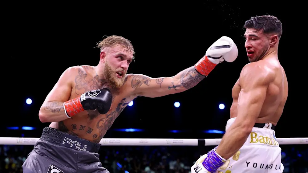 Jake Paul punching Tommy Fury